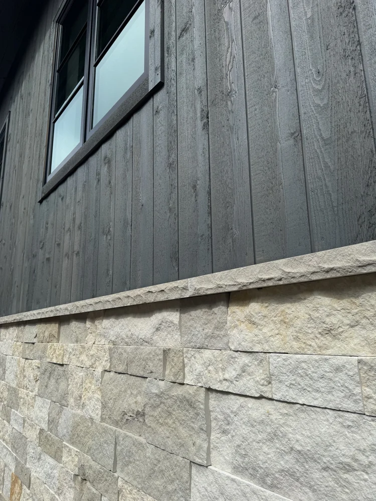 Buff wainscot caps and Hamptons Estate veneer on a facade.