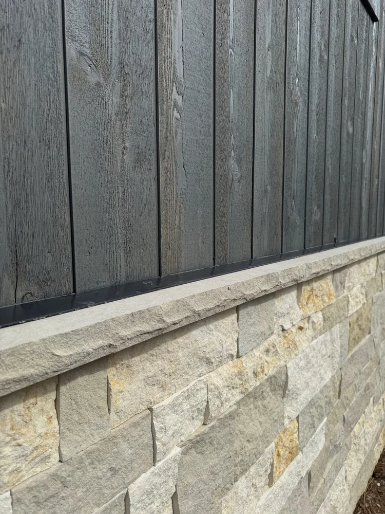 Buff wainscot caps and Hamptons Estate veneer on a facade.