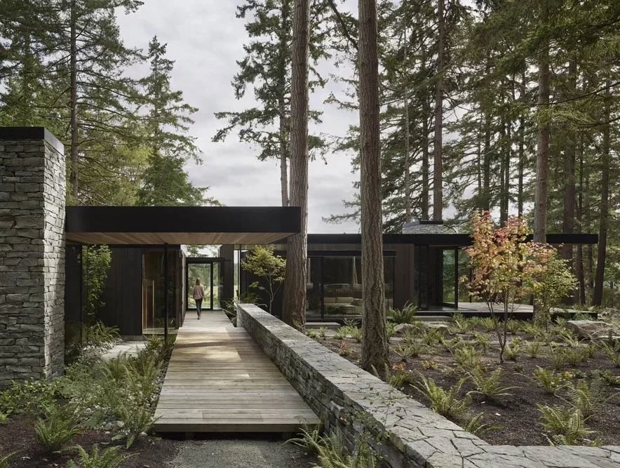 Whistler Basalt ledgestone veneer in a natural face with dry-stack joints across a facade and entry.