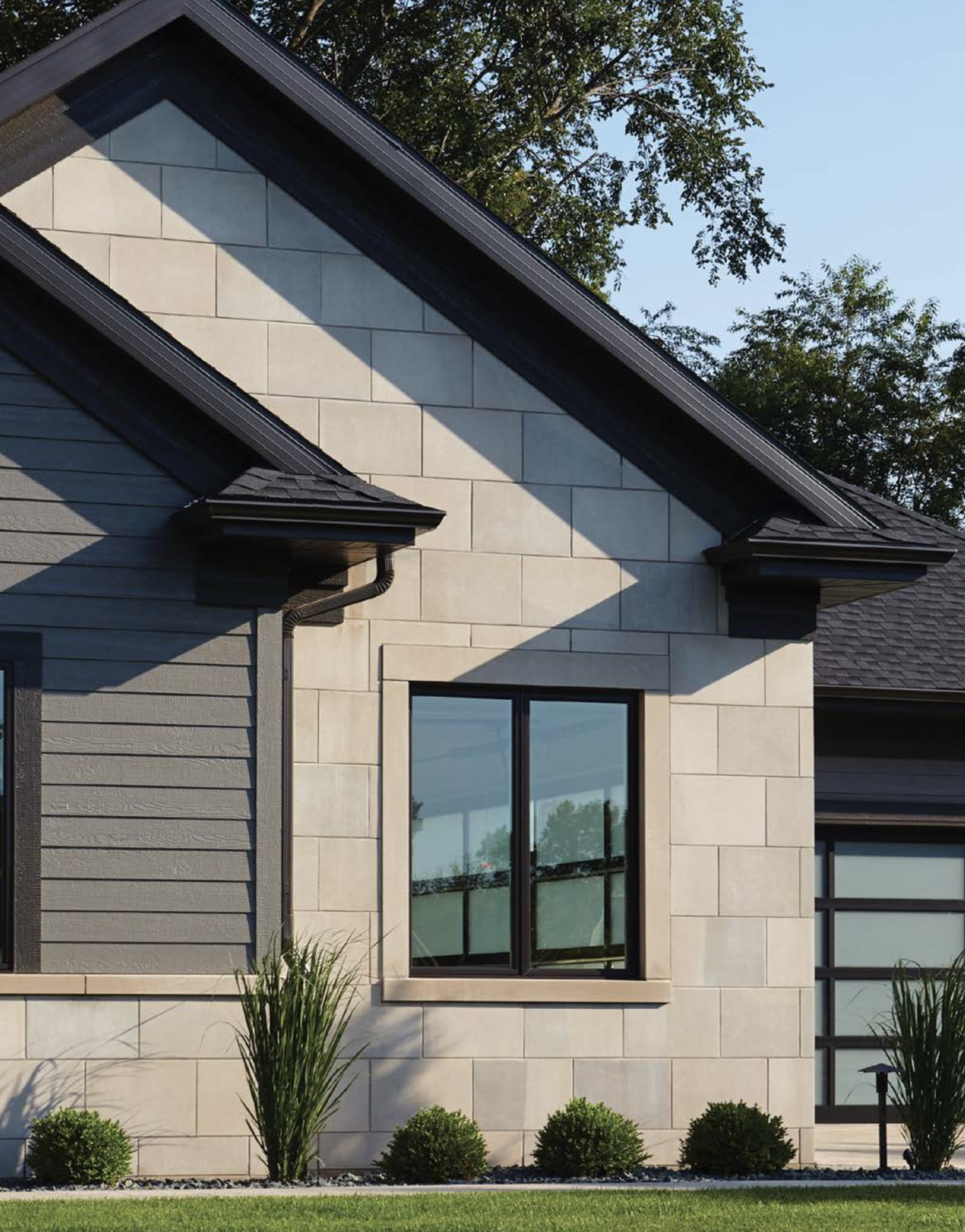 Indiana Limestone laid as panel veneer in honed face and Indiana Limestone sills, lintels, and jambs on a facade.