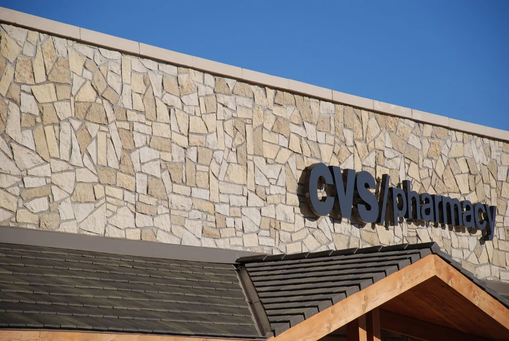 Chestnut Shell mosaic veneer in split face across a CVS Pharmacy storefront.