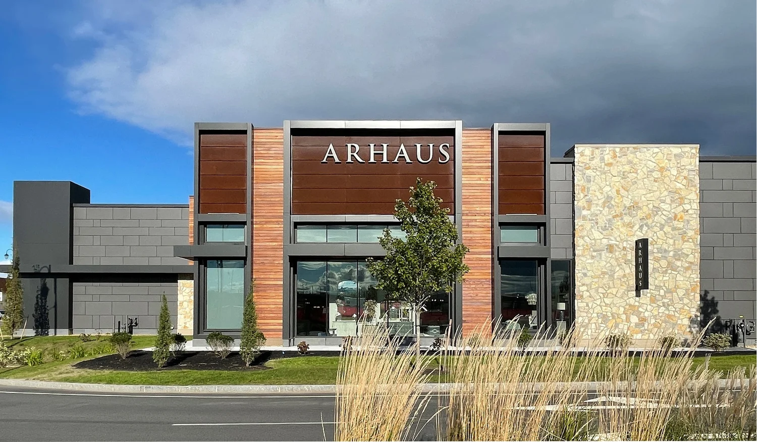 Tuscany Bronze mosaic veneer on a facade and entry in split and natural faces with flush joints.