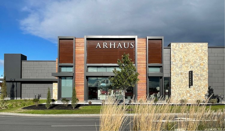 Tuscany Bronze mosaic veneer on a facade and entry in split and natural faces with flush joints.