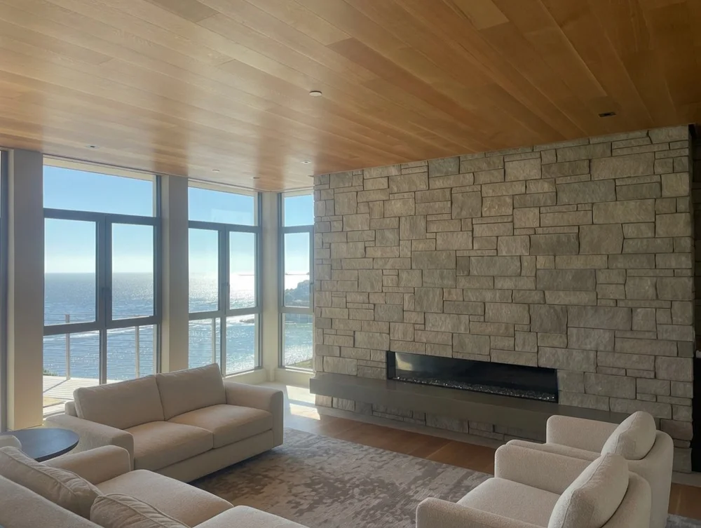 Indiana Limestone ashlar veneer in split face with raked joints on an interior fireplace.