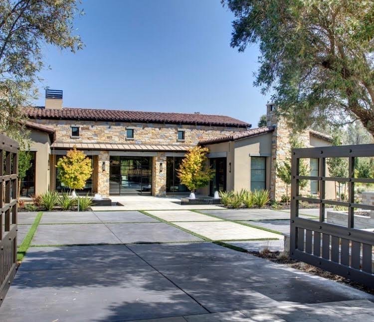 Napa Valley Estate ashlar veneer in split and natural faces with honed Charcoal pavers across a home facade and entry.