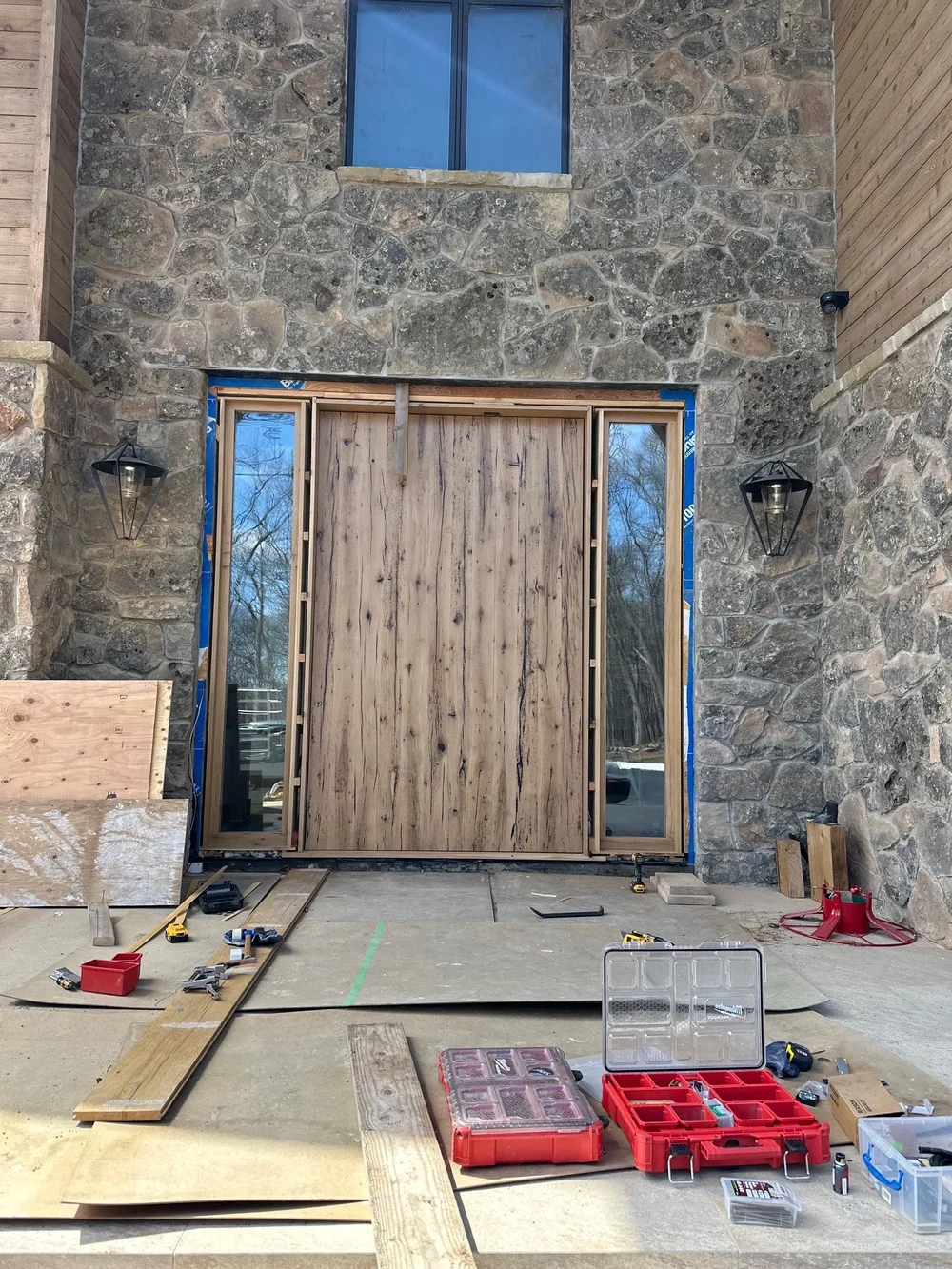 Split-face Montana Moss mosaic veneer framing an entry.