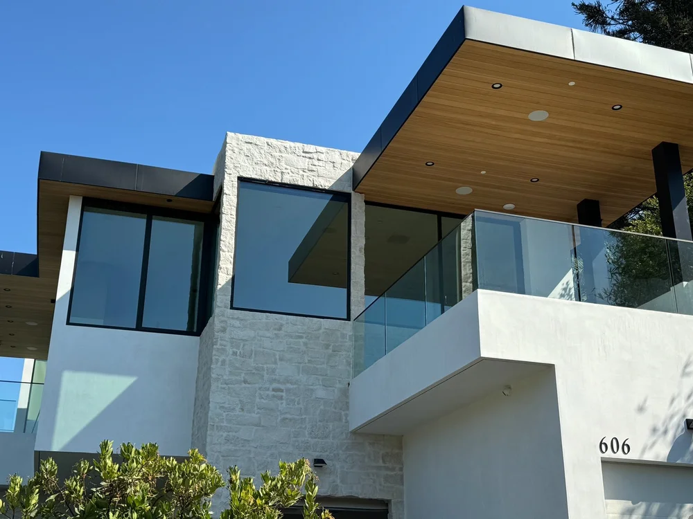 Cottonwood split-face veneer with overgrout joints framing the entry of a Los Angeles home.