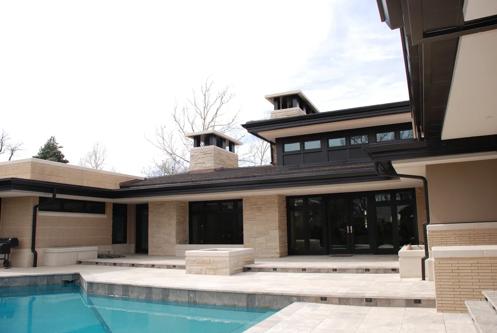 Split-face Prairie Shell ashlar veneer across a wide facade elevation.