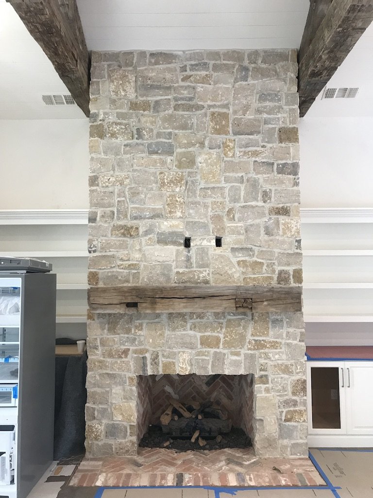 Tuscany Gold field veneer on an interior fireplace in split and natural faces.