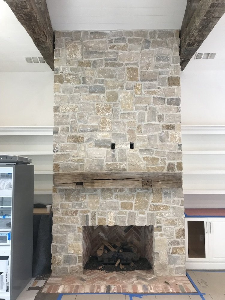 Tuscany Gold field veneer on an interior fireplace in split and natural faces.
