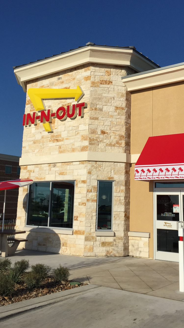 Rustic Earth split-face ashlar veneer on a Texas restaurant facade and entry.