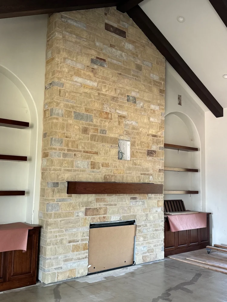 Napa Valley Estate ashlar veneer with split and natural faces and overgrout joints on an interior fireplace surround.