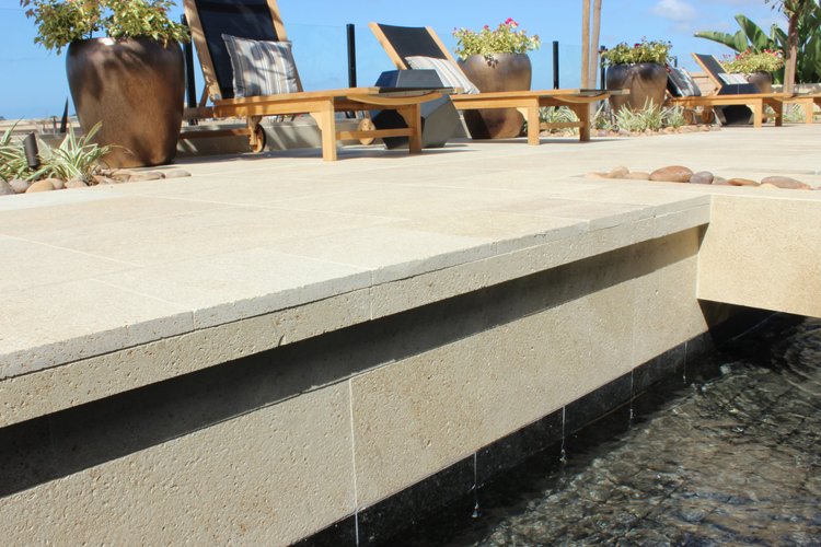 Prairie Shell dimensional pavers in a brushed finish around a pool.