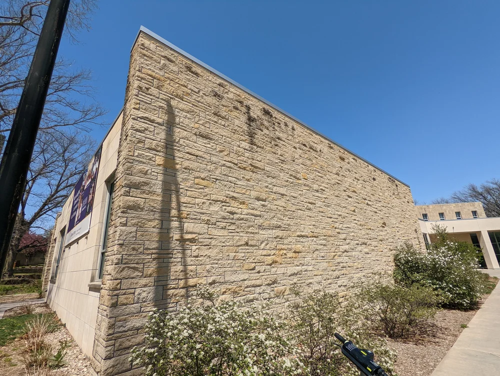 Onaga in the Bradford pattern, split-face ashlar across a university building facade.