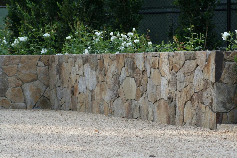 Irregular Yountville mosaic pieces fitted tight along a wall.