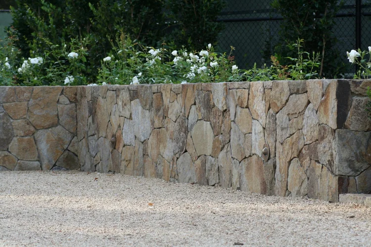 Irregular Yountville mosaic pieces fitted tight along a wall.