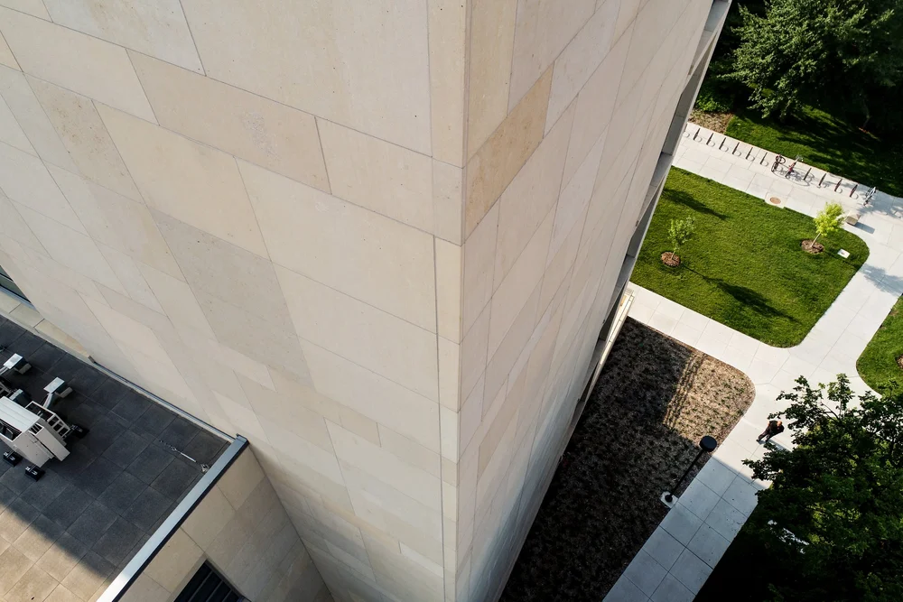 Silverdale honed panel veneer in smooth dimensional courses on a commercial facade.