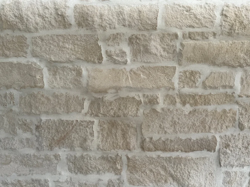 Cottonwood ashlar veneer sample in split face with chopped ends.