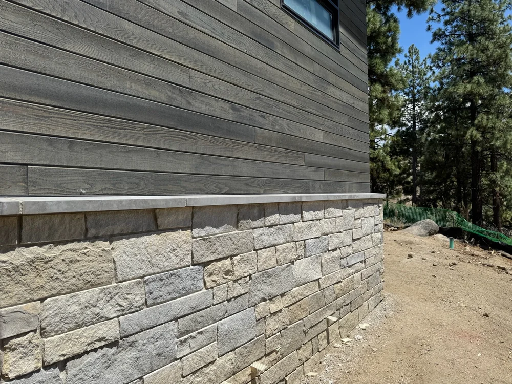 Bellevue Estate veneer and Charcoal wainscot caps on a facade.