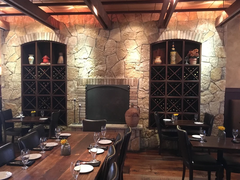 Tuscany Gold field veneer wrapping an interior space in split and natural faces with raked joints.