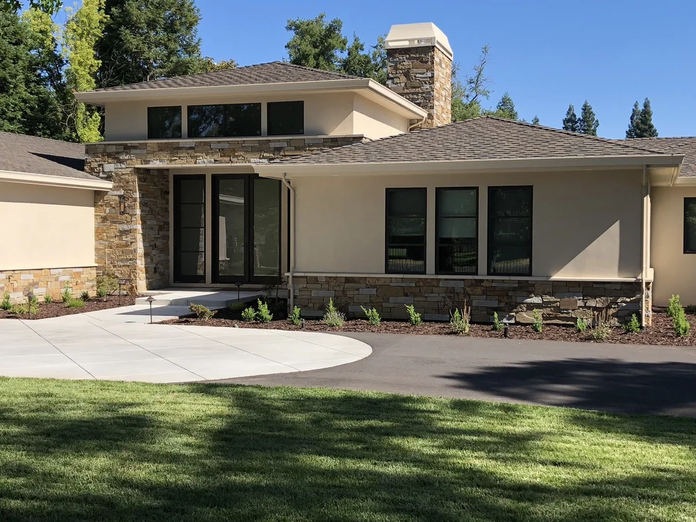 Monterey Estate ashlar veneer in split and natural faces across a home facade and entry.