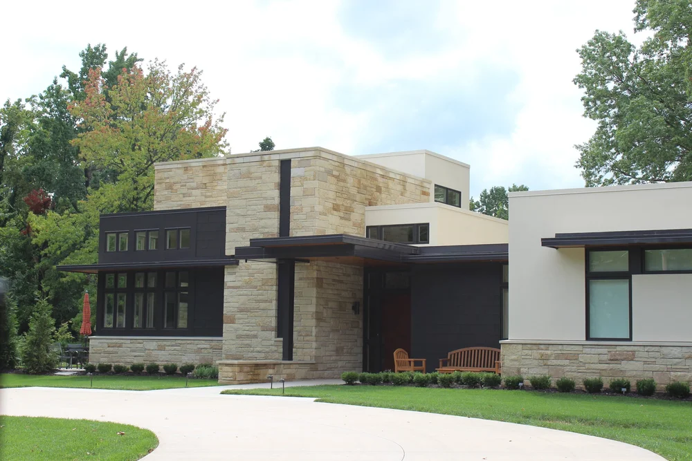 Prairie Shell veneer with honed wall and wainscot caps across a facade.