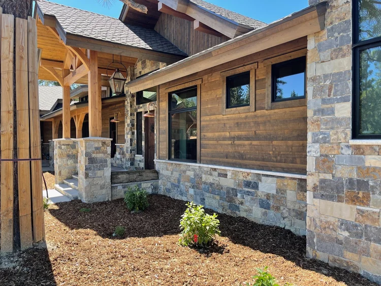 Aspen Estate veneer, Indiana Limestone pavers, and Indiana Limestone column caps, sills, and wainscot caps on an entry.