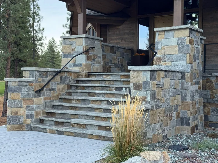 Aspen Estate veneer, Silver Mountain treads, and Silver Mountain wall caps, column caps, and wainscot caps on a facade.
