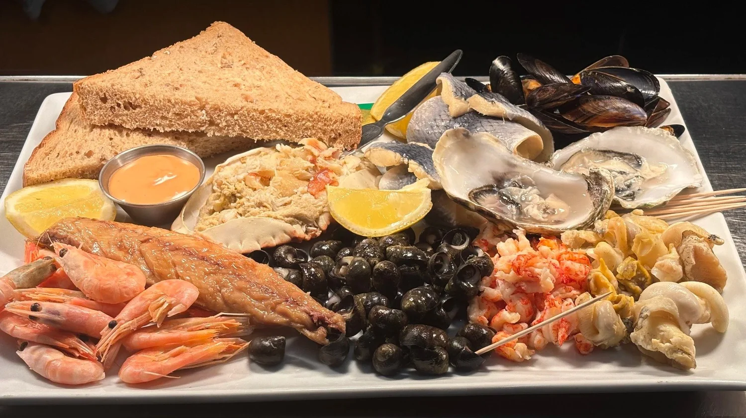 A Rosebud seafood platter with shellfish and lemon
