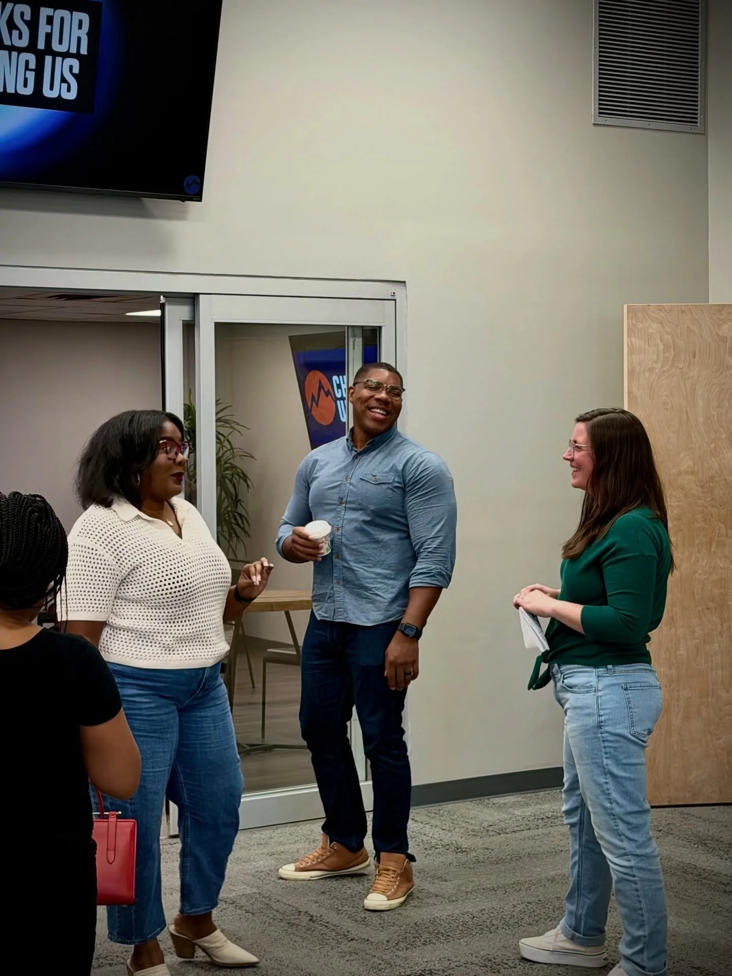 People talking together in the Church Unlimited lobby