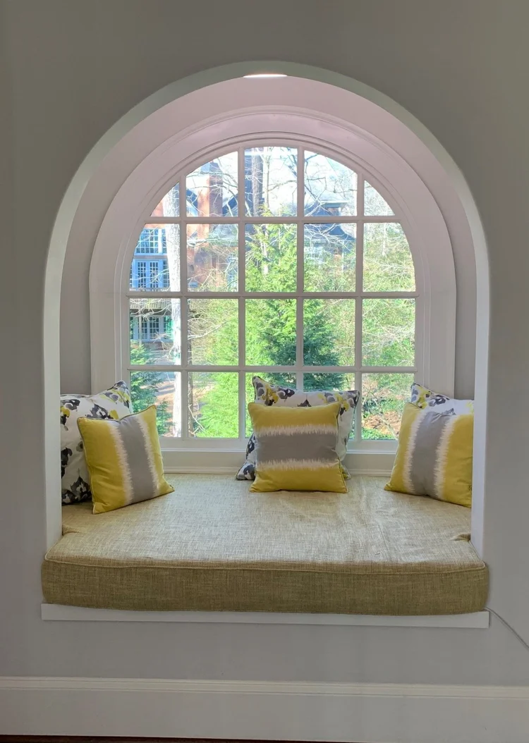 Arched window seat with recessed accent lighting in the Atlanta house
