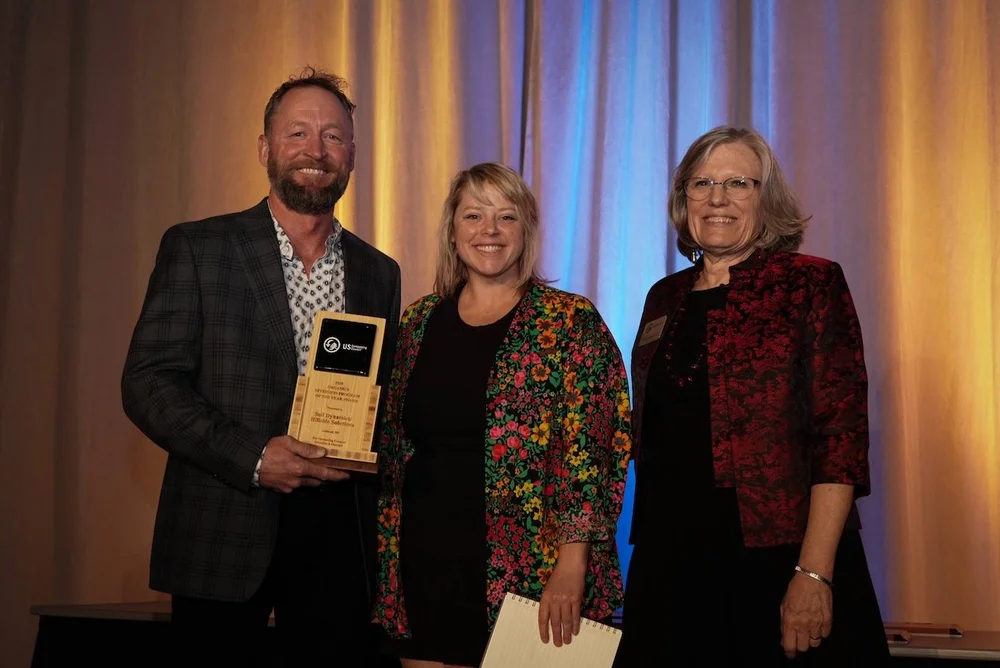 Andy Harpenau accepting the US Composting Council's 2025 Organics Diversion Program of the Year award for Soil Dynamics and Hillside Solutions