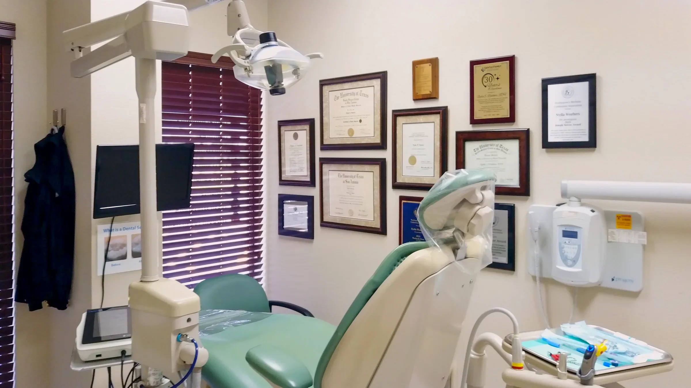 GFID dental treatment room with credentials wall