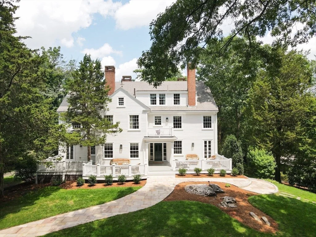 Same Massachusetts colonial after Smart Domain renovation — restored exterior, refreshed landscape, prepared for sale