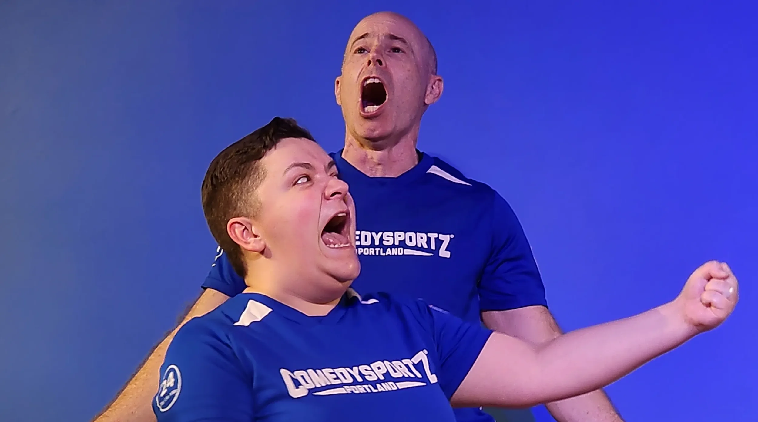 ComedySportz players performing on stage
