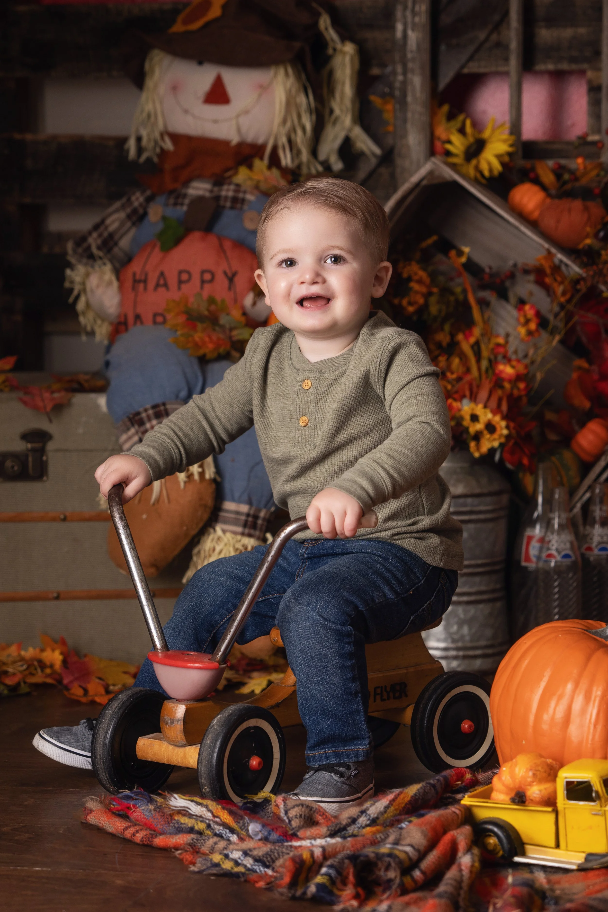 Autumn child portrait with pumpkins