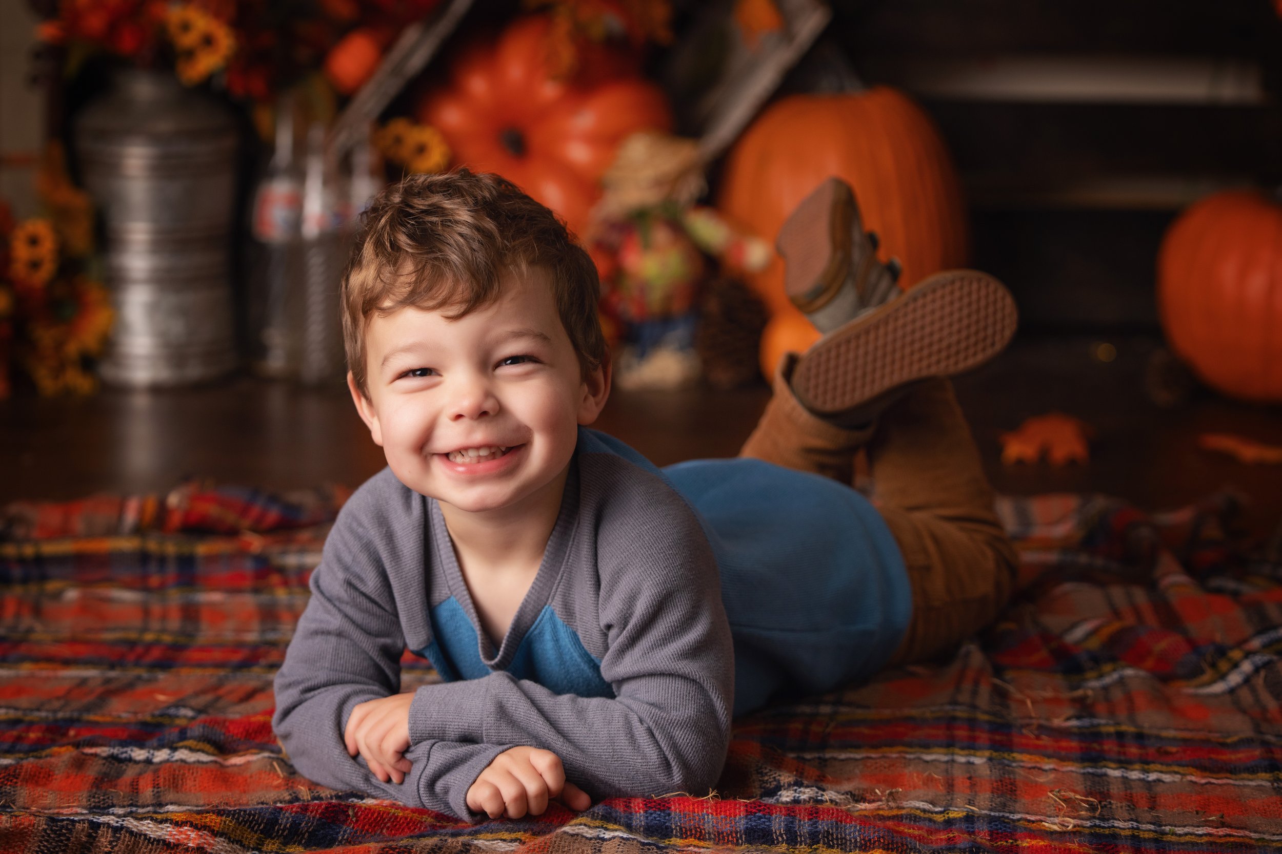 Child smiling in Pumpkin Patch scene