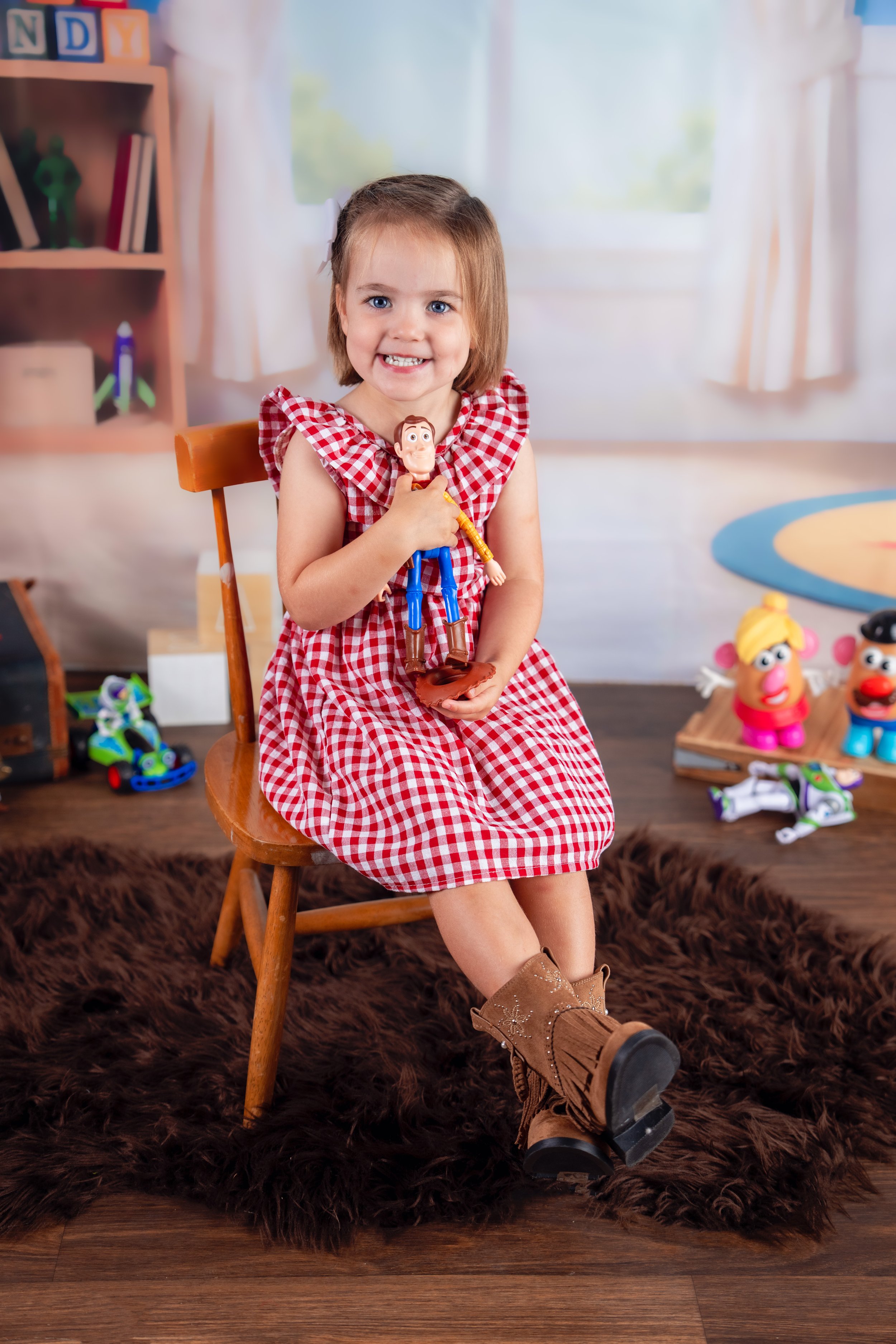 Child enjoying an Andy's Room inspired portrait session at Matt & Shea Photography