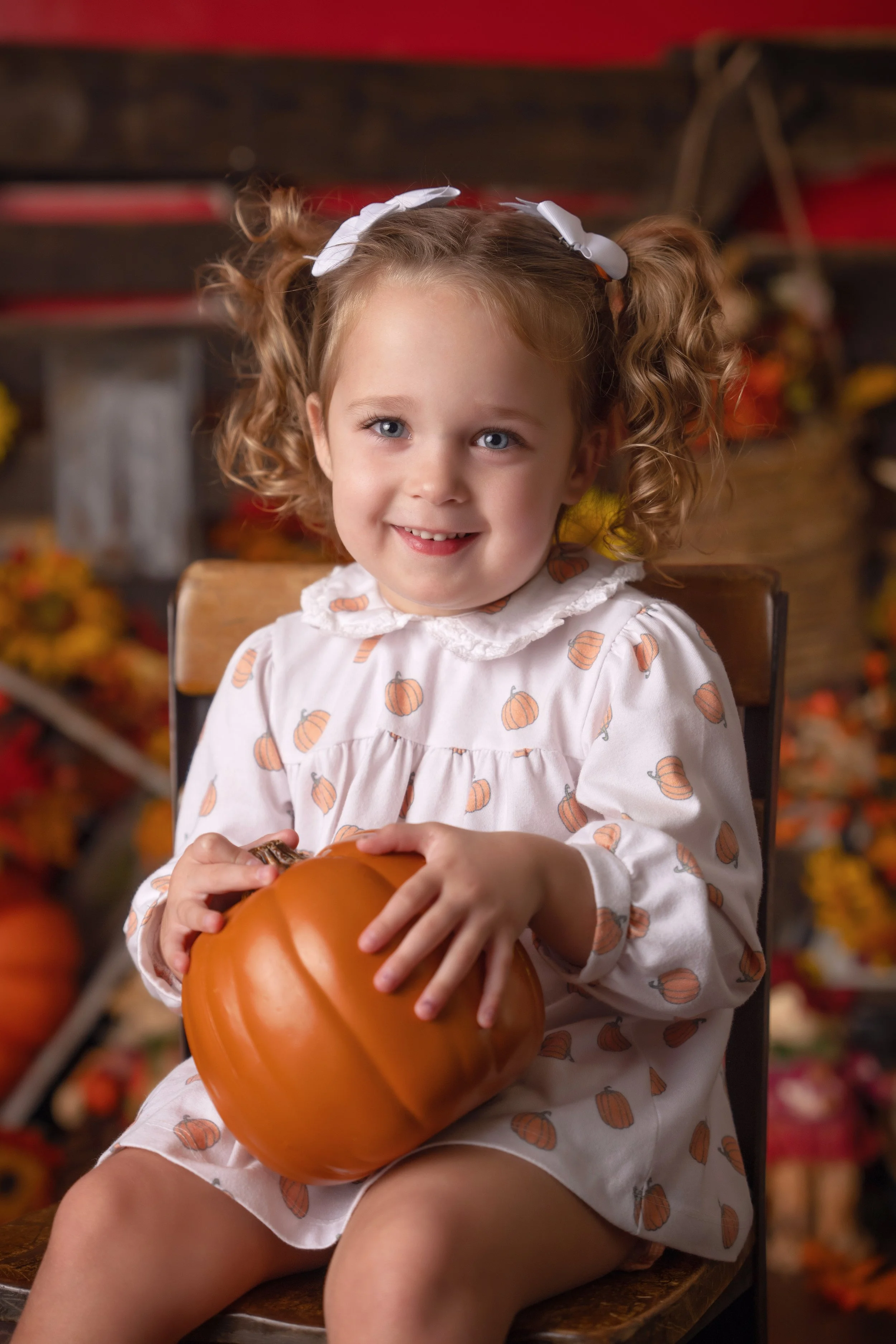 Pumpkin and hay seasonal portrait