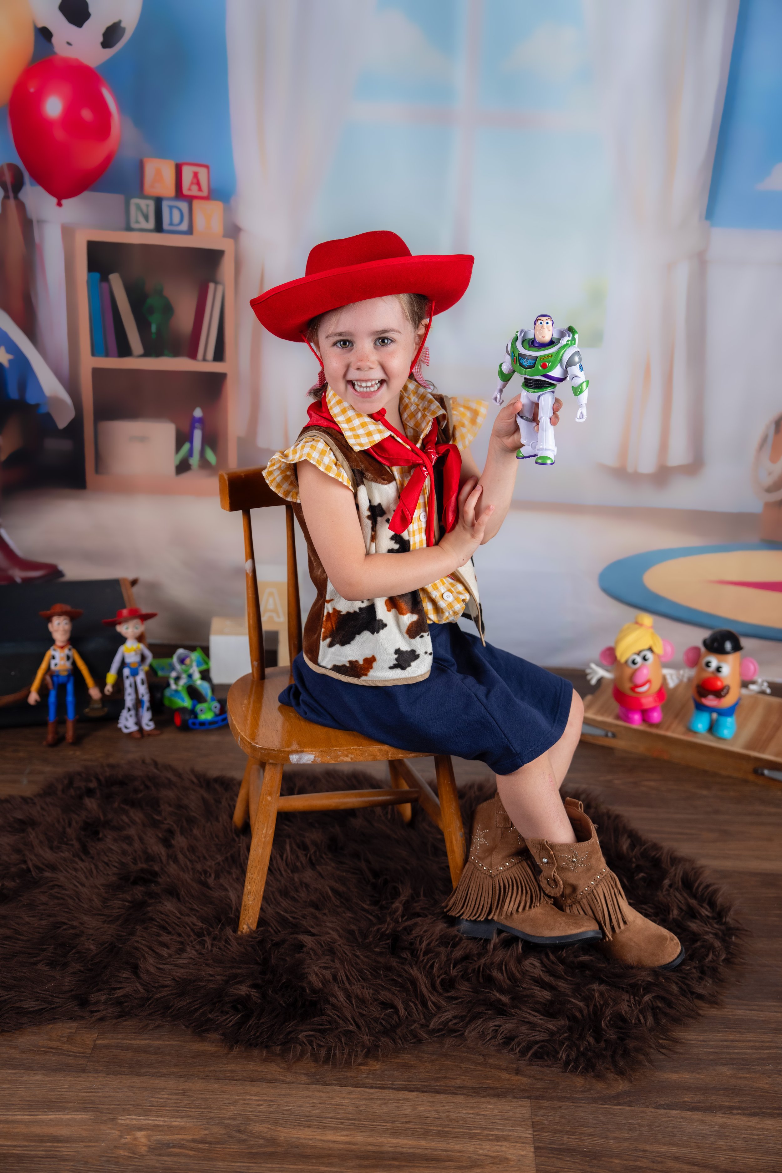 Playful child's portrait in the colorful Andy's Room set