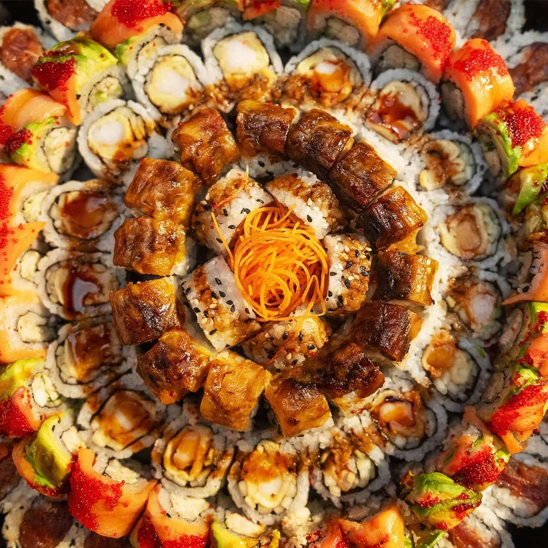 Chef rolling sushi on demand