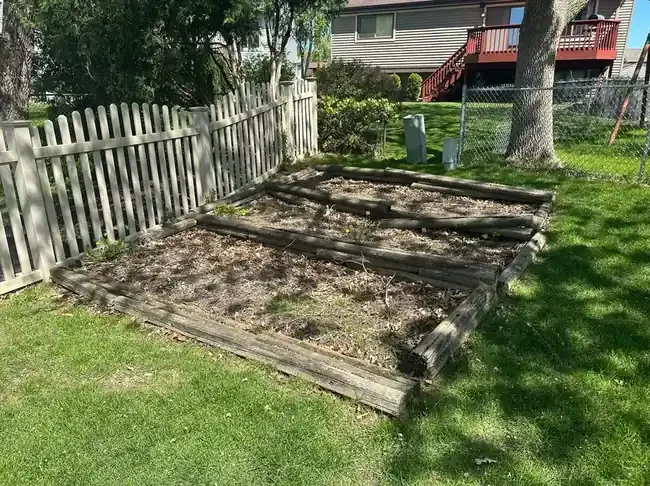 Tiered landscape bed before rebuild in Roselle, Illinois.