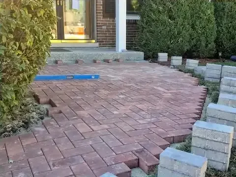 Front-entry paver patio construction in progress in Schaumburg, Illinois.