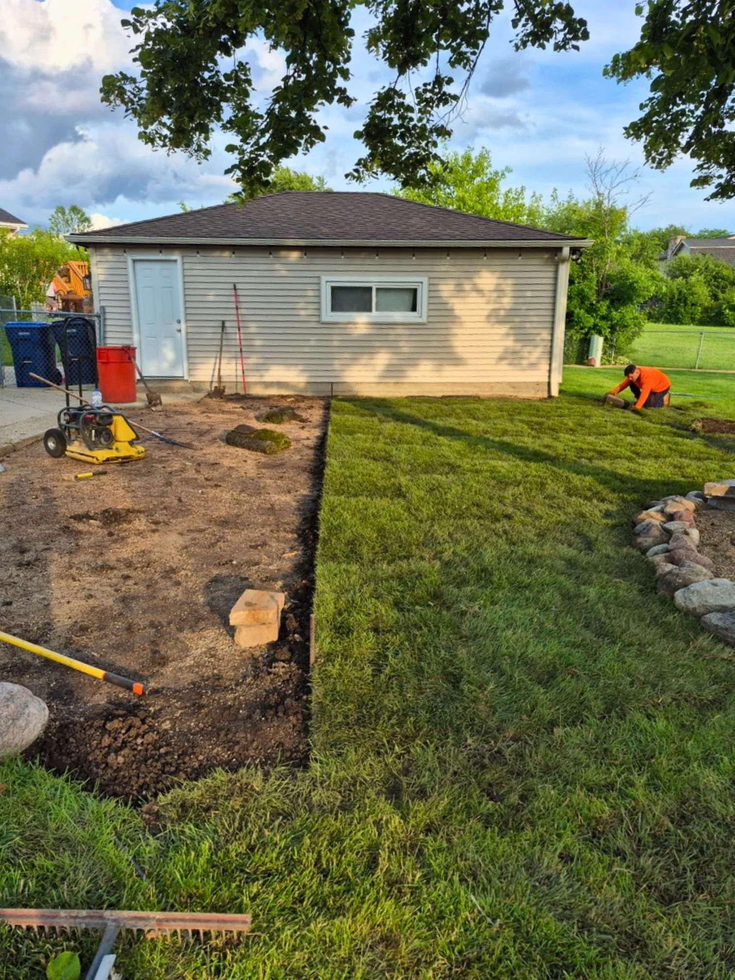 Sod restoration in progress beside the patio extension in Roselle, Illinois.