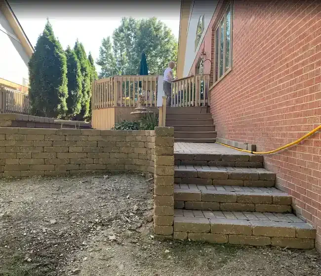 Paver steps and retaining wall during repair in Roselle, Illinois.