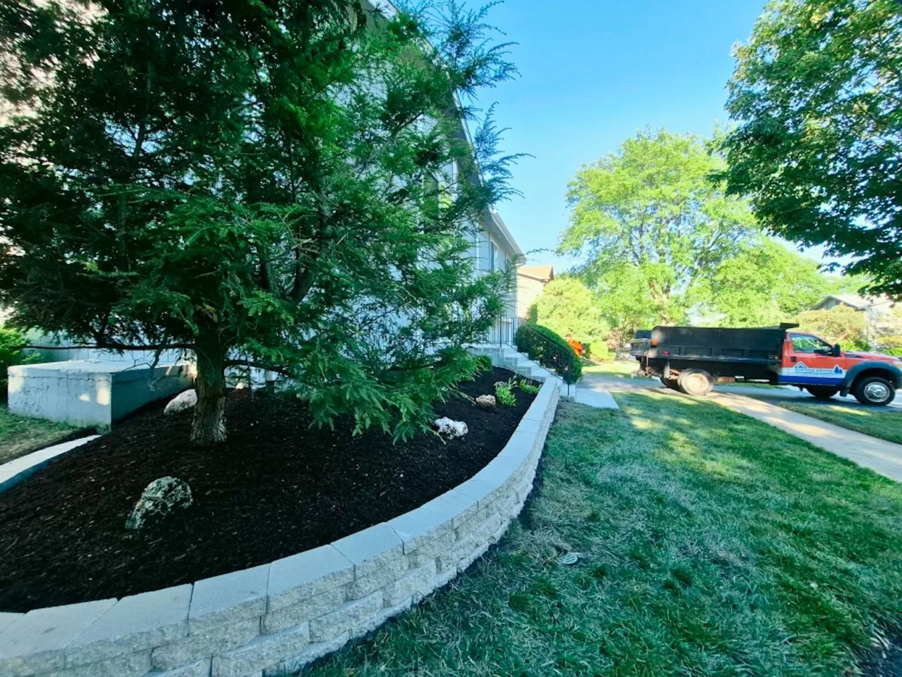 Front foundation retaining wall mulch bed in Roselle, Illinois.