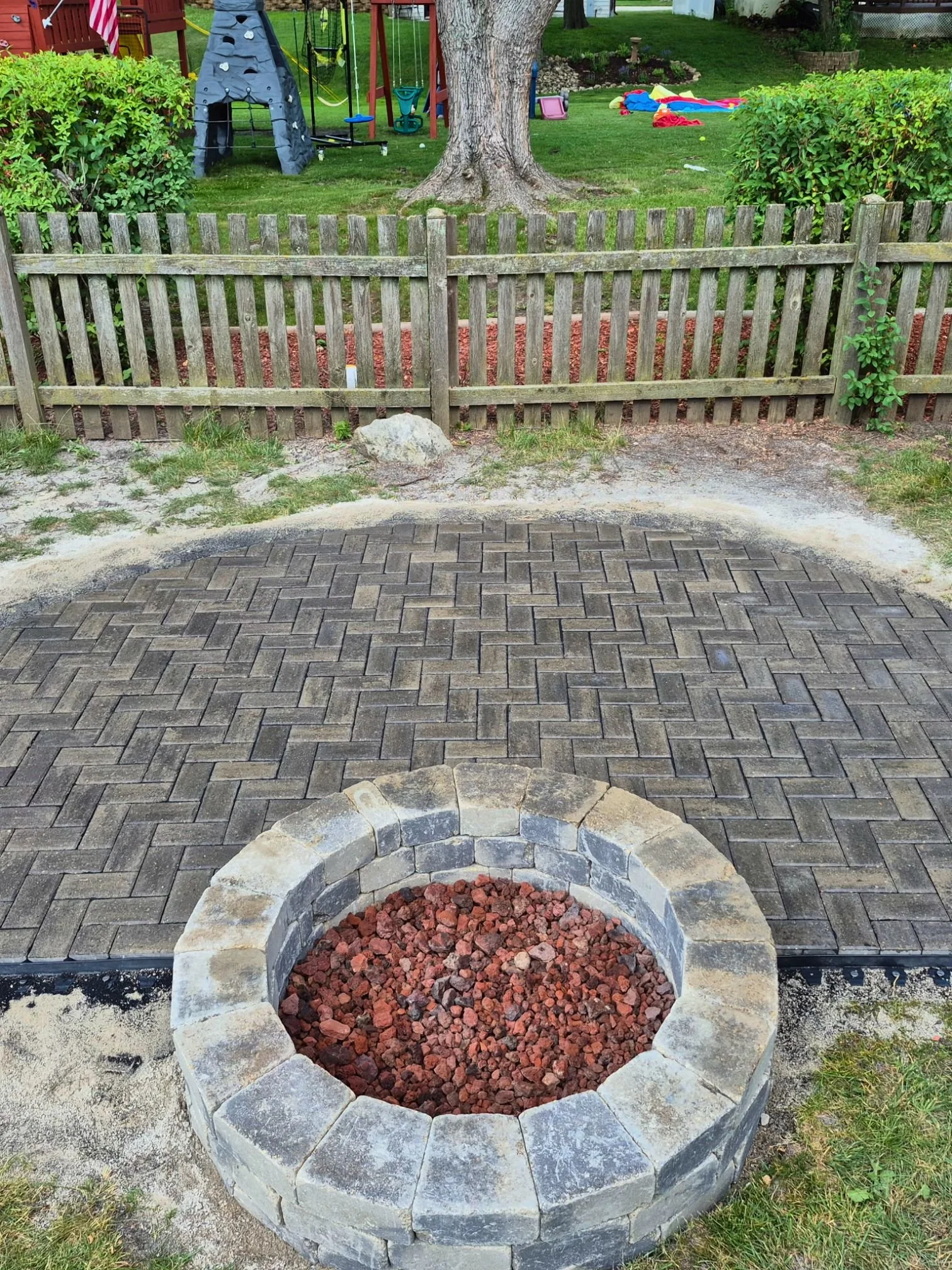 Paver patio fire pit herringbone in Bartlett, Illinois.
