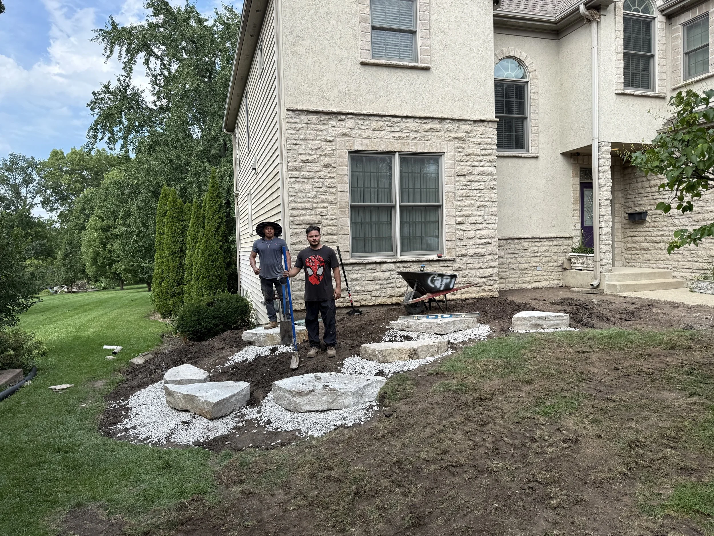 Natural limestone outcropping installation by Home Pride Landscape & Design in Itasca, Illinois.