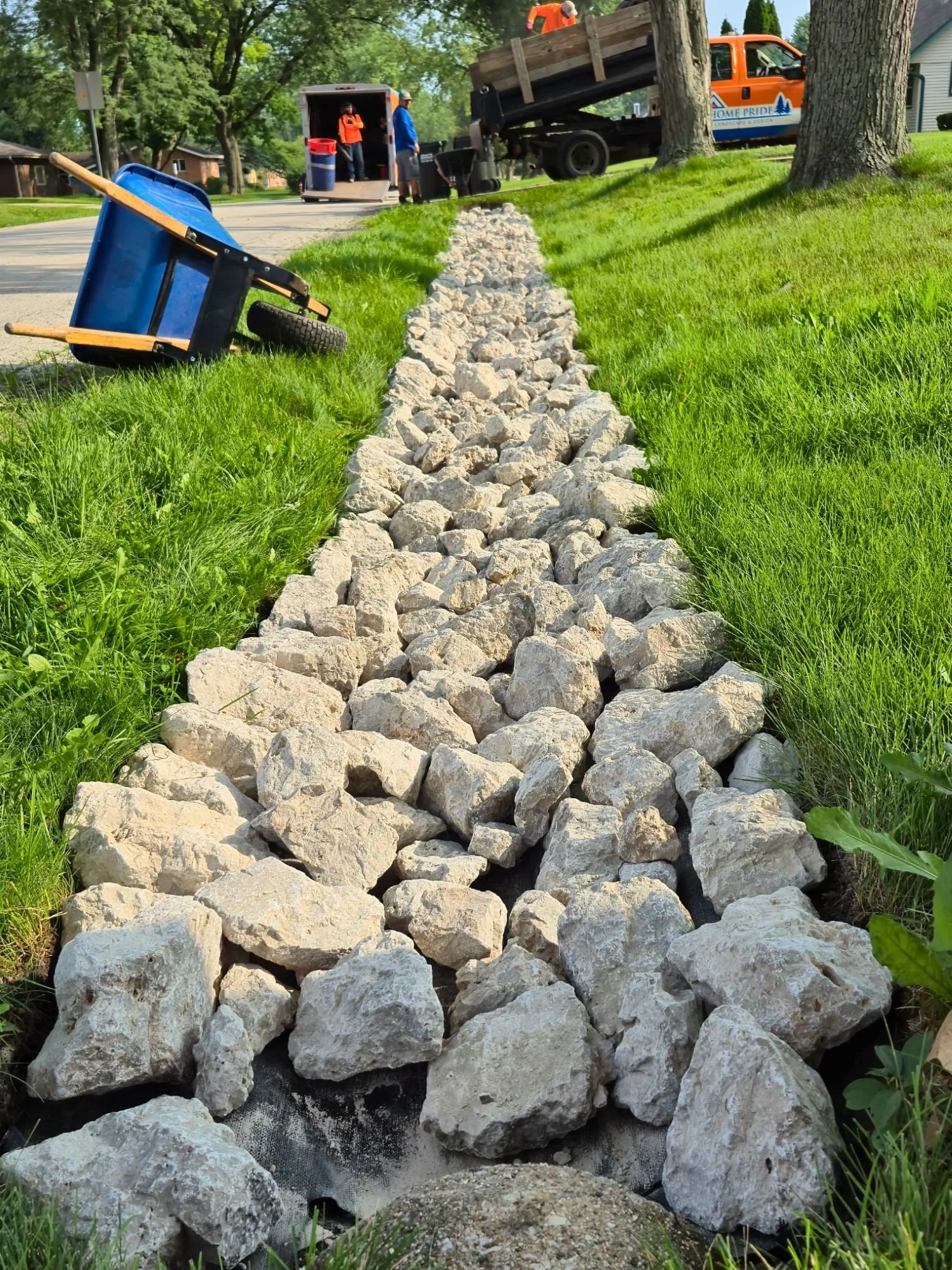 Stone drainage swale river rock in Medinah, Illinois.