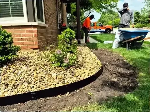 Decorative rock bed installation in progress in Bloomingdale, Illinois.
